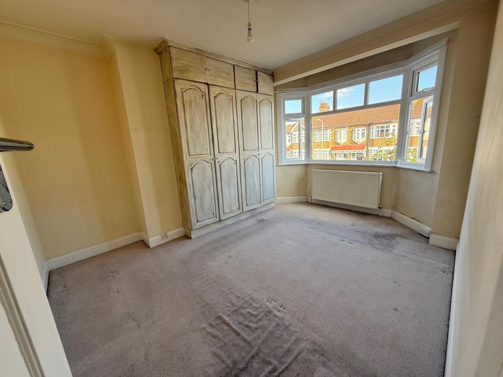 Lot: 59 - THREE-BEDROOM HOUSE FOR REPAIR AND IMPROVEMENT - Bedroom with window to front aspect